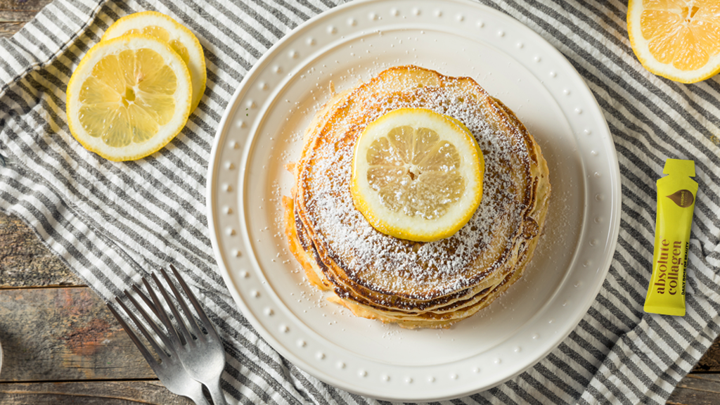 Photo of a plate of pancakes alongside a sachet of Absolute Collagen